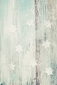 Powdered sugar stars on a wooden background with wood grain detailing