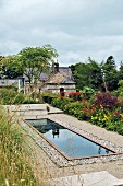 A garden pond framed by old cobblestones in Blessington, Ireland