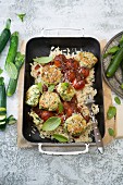 Zucchini and cheese balls with orzo noodles and spicy red wine sauce