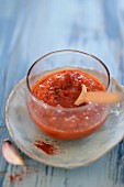Red mojo sauce in a glass bowl (Canary Islands, Spain)