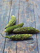 Bitter cucumbers on a wooden background