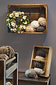 Wreath with cotton bolls in wooden crate hung on wall