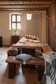 Rustic wooden furniture and wintry decorations in cabin parlour