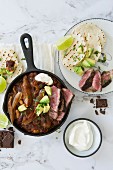 Mexican chili with chocolate and rump steak with tortillas