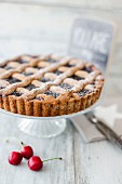 Linzer cake dusted with icing sugar