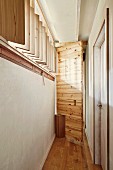 Pivoting wooden door in renovated hall