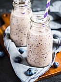 Vegan blueberry smoothie in small bottles
