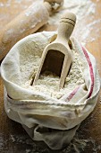 A sack of flour with a scoop