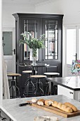 Tall table with industrial-style bar stools in kitchen