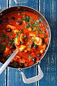 Turkey breast gulash with tomatoes, olives and capers