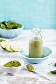 A lime and spinach smoothie with matcha tea