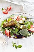 Wild herb salad with feta and strawberries