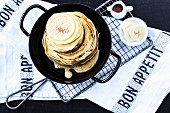 Pancakes with maple syrup and banana