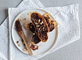 Toasted bread with nutella and chopped nuts