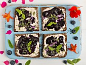 Vegan yogurt and blueberry jam on toast
