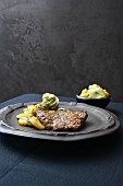 Neck steak with herb butter and a potato and cucumber salad