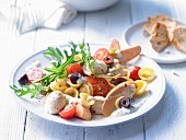 Mediterranean noodle salad with vegetarian sausages and Parmesan dressing