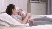 Baby lying on mother's chest