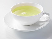 Green tea in a white porcelain cup
