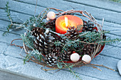 Candle in wreath made of Parthenocissus (wild wine) tendrils