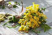 Spring bouquet made of primula veris (cowslip, heavenly key)