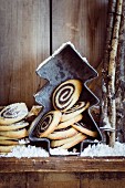 Poppy seed spiral pastries with icing sugar