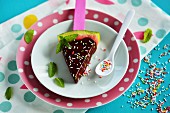 Watermelon slices glazed with chocolate and colourful sugar sprinkles