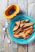 Roasted butternut squash & sweet potatoes garnished with sage