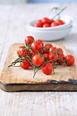 Cherry tomatoes on a wooden chopping board