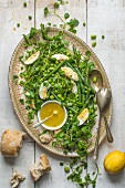 Bean, pea and egg salad with lemon dressing