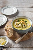 Smoked fish and courgette creamy chowder with bread and butter