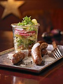 Potato salad in a glass with Merguez sausages (Christmas)