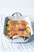 Oven-baked Austrian-style rolled pancakes in a casserole dish