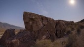 Milky Way and Moon over petroglyphs, time-lapse footage