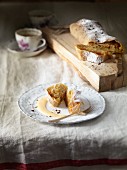 Apple strudel with icing sugar and vanilla sauce