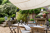 Garden table and chairs under awning