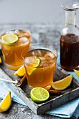 Homemade cola with ice cubes and lime slices