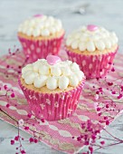 Cupcakes with cream and pink hearts