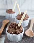Chocolate cupcakes with chocolate sprinkles and chocolate curls