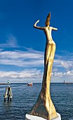 A bronze sculpture of Esperanza by the artist Ene Slawow on Mittelmole, Rostock, Germany