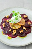 Beetroot carpaccio with salt and herb cream cheese