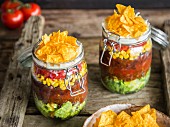 Layered taco salad in glasses