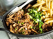 Sous vide cooked pulled pork with French fries