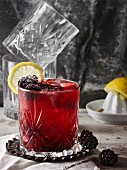 A Bramble cocktail with gin and blackberry liqueur