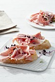 Ciabatta with cooked ham and shoots