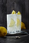 Two glasses of Gin Fizz with lemon