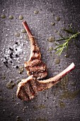 Grilled lamb chops with rosemary, salt and pepper