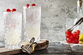 Tom Collins with cocktail cherries