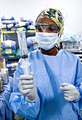 Surgeon preparing equipment
