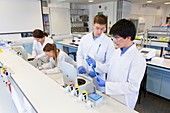 Chemistry students using centrifuges
